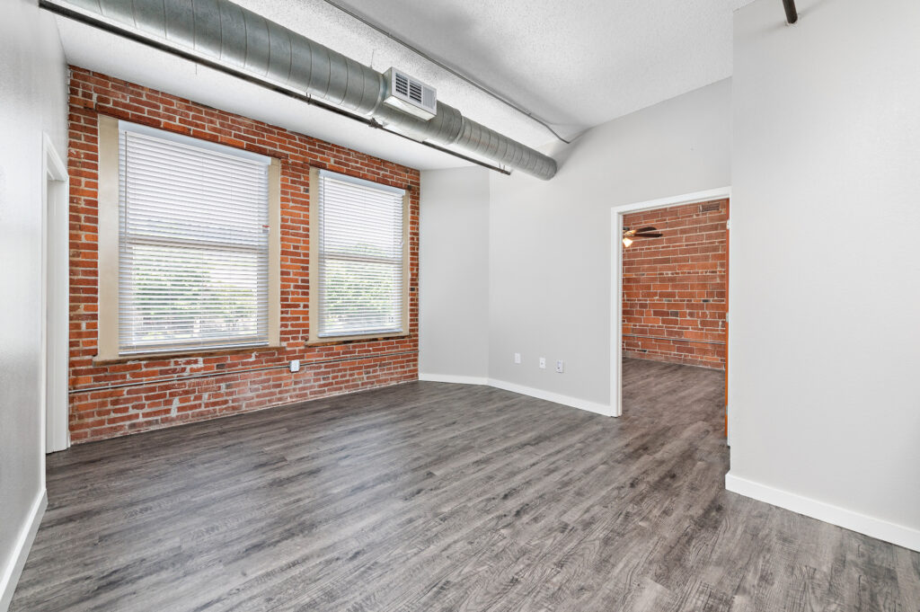 Loft interior with exposed brick and large windows